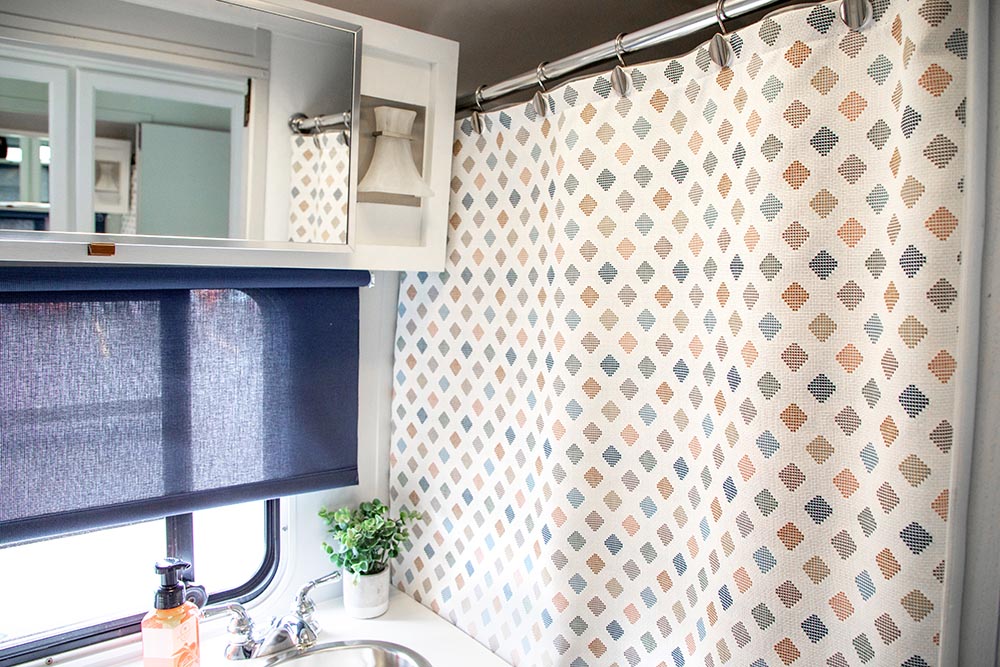 We used Sunbrella upholstery fabric to make a mold-resistant shower curtain.